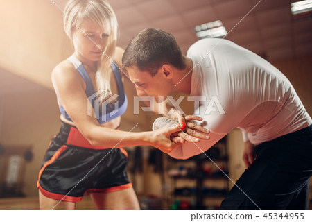Painful grip of the hand, female self-defense Painful grip of the hand, female self-defense 45344955