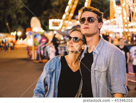 Lovely young hipster couple dating during summer sunset. Lovely young hipster couple dating during summer sunset. 45346202