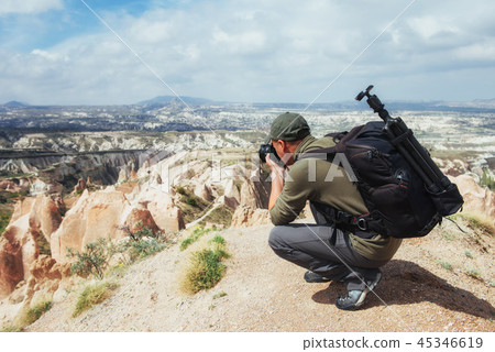Photographer sandstone cliff and observing the natural landscape Photographer sandstone cliff and observing the natural landscape 45346619