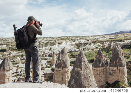 Man takes pictures of the valley love altitude mountains. Cappad Man takes pictures of the valley love altitude mountains. Cappad 45346796