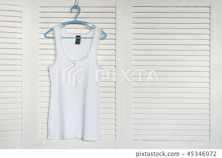 White jersey on the hanger. White shutters 45346972