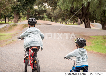 Kids riding bicycles Kids riding bicycles 45348575