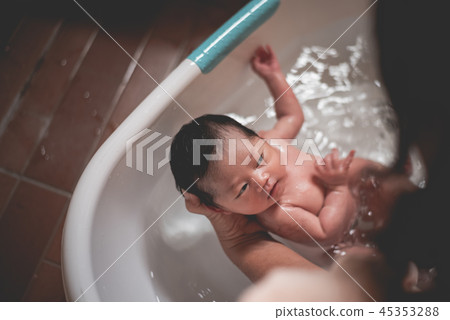 baby taking a shower with her mom baby taking a shower with her mom 45353288