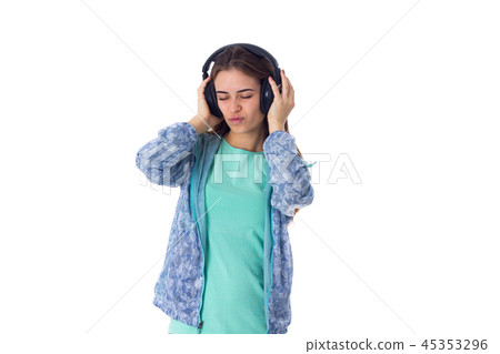 Young woman in headphones Young woman in headphones 45353296