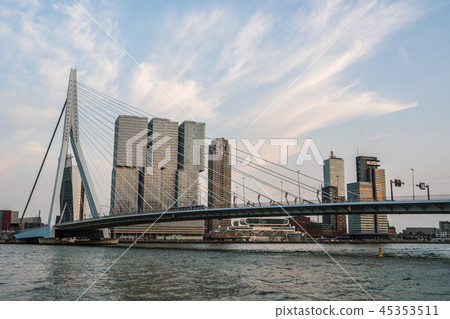 Evening Rotterdam Skyline with Erasmus Bridge Kop van Zuid neighborhood, The Netherlands Evening Rotterdam Skyline with Erasmus Bridge Kop van Zuid neighborhood, The Netherlands 45353511