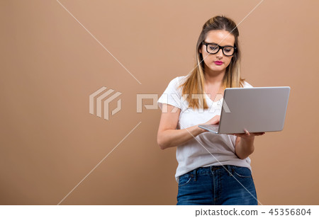 Young woman with a laptop computer Young woman with a laptop computer 45356804