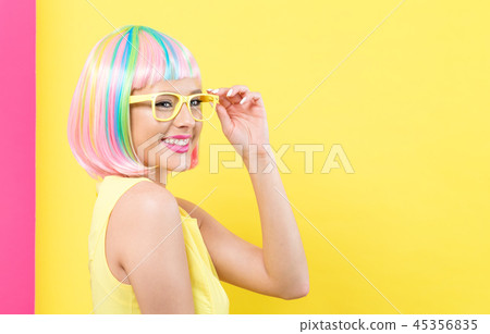 Woman wearing sunglasses in a colorful wig Woman wearing sunglasses in a colorful wig 45356835