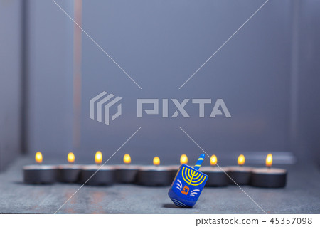 Defocused lights of Jewish holiday Hanukkah and spinning top Defocused lights of Jewish holiday Hanukkah and spinning top 45357098
