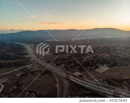 Desert asphalt road with cars. Aerial view Desert asphalt road with cars. Aerial view 45357649