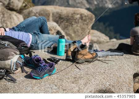 Tourist people resting in camp and dry the shoes Tourist people resting in camp and dry the shoes 45357905