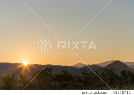 sunset over the mountains 45358711