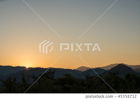 sunset over the mountains 45358712