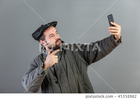 Caucasian man 35 years old doing selfie, studio 45358982