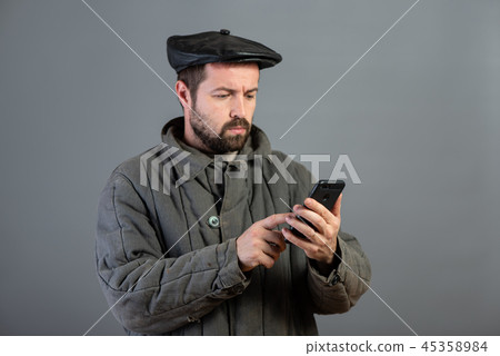 Caucasian man with concentrated view at smartphone 45358984