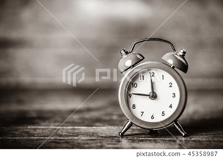 Retro alarm clock on a table 45358987