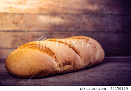 white bread on a wooden table. 45359119