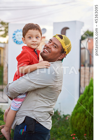 Happy father holding son Happy father holding son 45363095