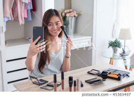 Asian young female blogger recording vlog video 45363497