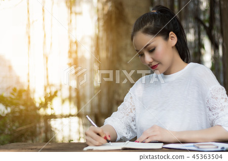 Freelance woman worked at the park. 45363504