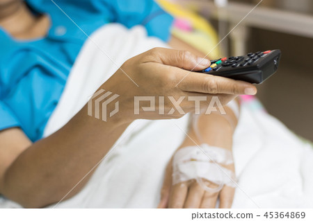 Close up of inpatient woman's Hand are using remote control for 45364869