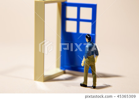 man standing in front of door into future man standing in front of door into future 45365309