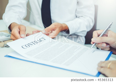 Business people negotiating a contract handshake Business people negotiating a contract handshake 45365313