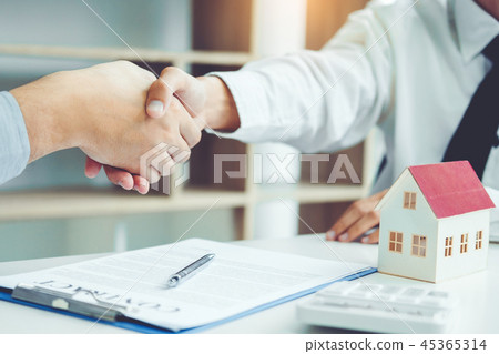 Business people negotiating a contract handshake Business people negotiating a contract handshake 45365314