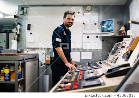 Marine engineer officer working in engine room Marine engineer officer working in engine room 45365815