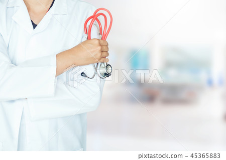 Doctor holding a stethoscope on background of Hosp Doctor holding a stethoscope on background of Hosp 45365883