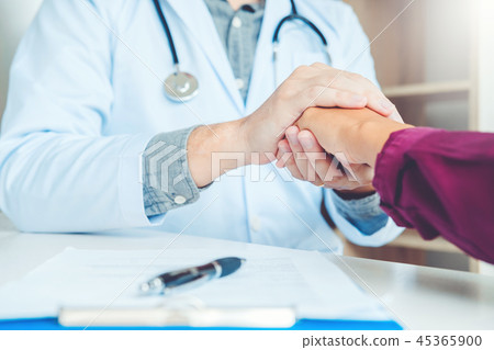 Doctor holding hands for comforting Doctor holding hands for comforting 45365900