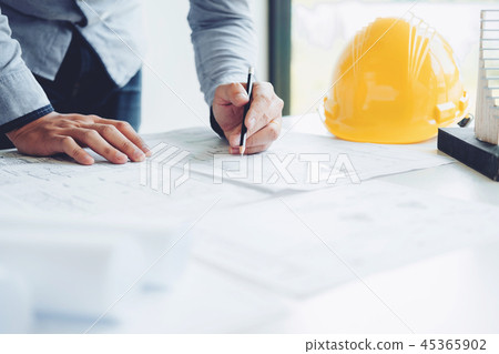 Architect or engineer working in office blueprint Architect or engineer working in office blueprint 45365902