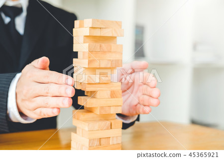 Businessman plan and strategy Domino Effect Businessman plan and strategy Domino Effect 45365921