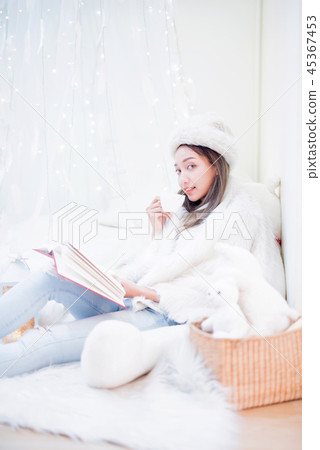 Young woman enjoying winter season. Young woman enjoying winter season. 45367453