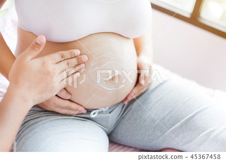 Asian pregnant woman with big belly. Relax at home Asian pregnant woman with big belly. Relax at home 45367458
