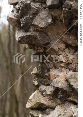 A piece of old destroyed walls of the fortress. Fragment of the old fortress wall. A piece of old destroyed walls of the fortress. Fragment of the old fortress wall. 45367490