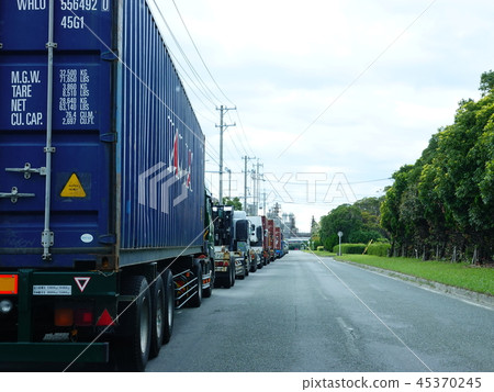 A scene of a "heavy truck" jamming on the road waiting for unloading A scene of a "heavy truck" jamming on the road waiting for unloading 45370245
