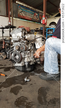 Technicians are repairing the engines Technicians are repairing the engines 45371622