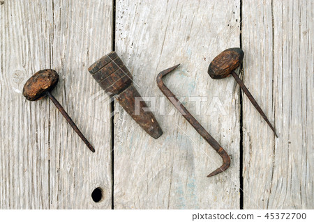 Chisel engraving with hook and cork on wooden plan 45372700