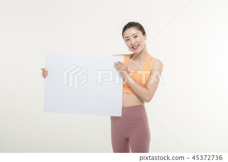 a woman holding an ad board on a white background a woman holding an ad board on a white background 45372736