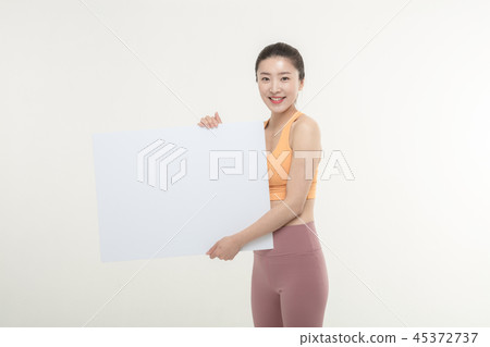 a woman holding an ad board on a white background a woman holding an ad board on a white background 45372737