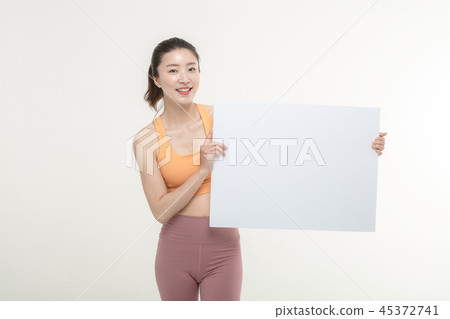 a woman holding an ad board on a white background a woman holding an ad board on a white background 45372741