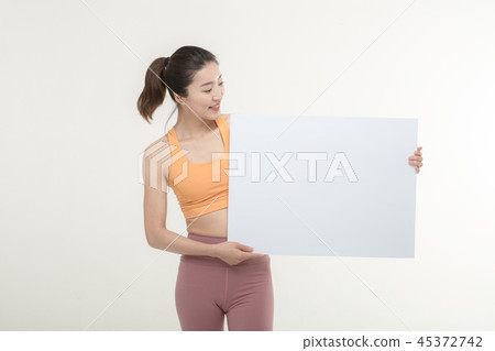 a woman holding an ad board on a white background a woman holding an ad board on a white background 45372742