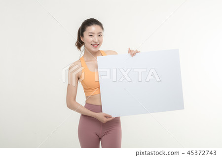 a woman holding an ad board on a white background a woman holding an ad board on a white background 45372743