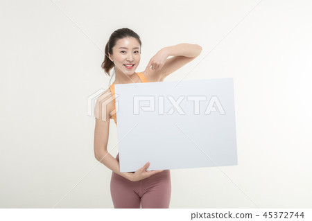 a woman holding an ad board on a white background 45372744