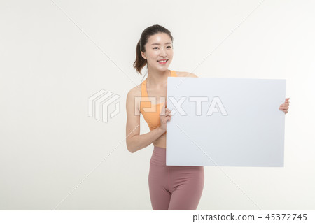 a woman holding an ad board on a white background a woman holding an ad board on a white background 45372745