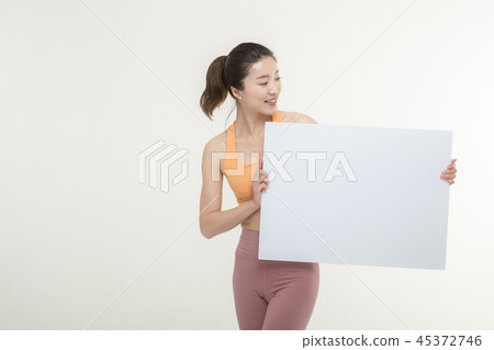 a woman holding an ad board on a white background a woman holding an ad board on a white background 45372746