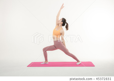 A Korean woman doing yoga exercise on mat 45372831