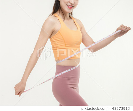 A Korean woman with a waist on a tape measure A Korean woman with a waist on a tape measure 45373913