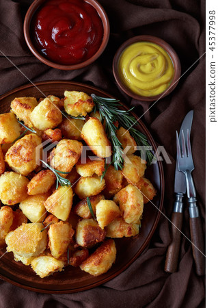 Roast Potatoes with spices and rosemary 45377998