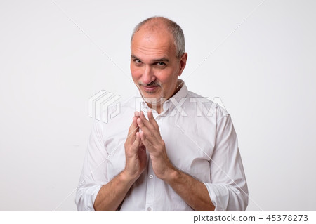 man thinking looking in side with hand together man thinking looking in side with hand together 45378273
